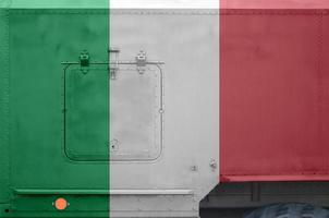 Italy flag depicted on side part of military armored truck closeup. Army forces conceptual background photo