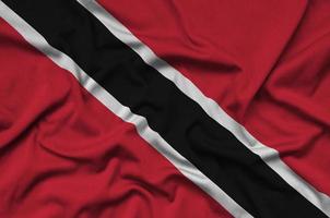 Trinidad and Tobago flag is depicted on a sports cloth fabric with many folds. Sport team banner photo