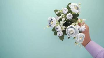 Overhead view of fake flowers placed in a vase video