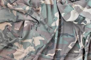 Camouflage background texture as backdrop for paintball and airsoft strikeball design projects photo