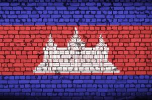 Cambodia flag is painted onto an old brick wall photo