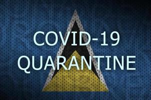 Saint Lucia flag and Covid-19 quarantine inscription. Coronavirus or 2019-nCov virus photo