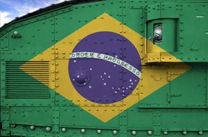 Brazil flag depicted on side part of military armored tank closeup. Army forces conceptual background photo