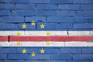 Cabo verde flag is painted onto an old brick wall photo