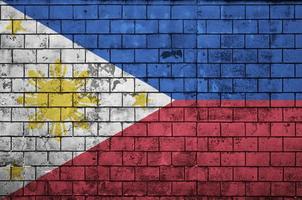 Philippines flag is painted onto an old brick wall photo