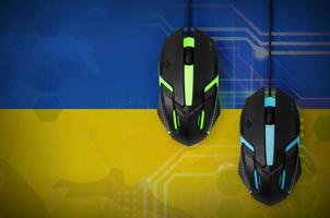 Ukraine flag and two mice with backlight. Online cooperative games. Cyber sport team photo