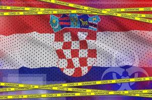 Croatia flag and Covid-19 quarantine yellow tape. Coronavirus or 2019-nCov virus concept photo