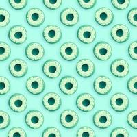 Many small plastic donuts lies on a pastel colorful background. Flat lay minimal pattern. Top view photo