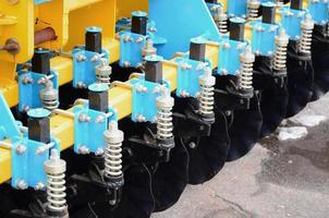 Spring system of agricultural seeder close up outdoors photo