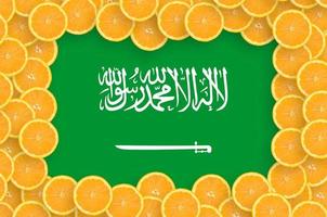 Saudi Arabia flag in fresh citrus fruit slices frame photo