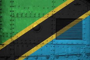 Tanzania flag depicted on side part of military armored tank closeup. Army forces conceptual background photo