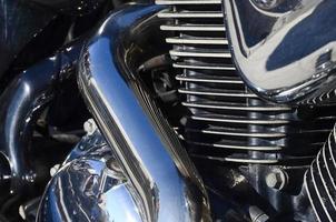 Fragment of chromed shiny body part of old classic motorbike photo