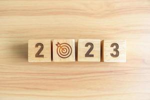 2023 block with dartboard icon. Goal, Target, Resolution, strategy, plan, Action, mission, motivation, and New Year start concepts photo