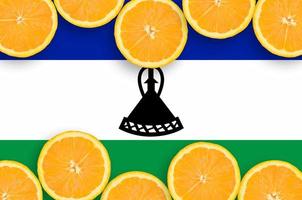 Lesotho flag in citrus fruit slices horizontal frame photo