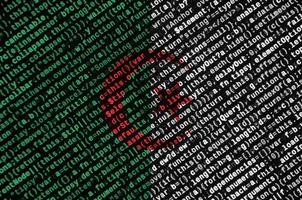 Algeria flag is depicted on the screen with the program code. The concept of modern technology and site development photo
