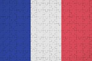 France flag is depicted on a folded puzzle photo