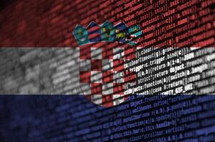 Croatia flag is depicted on the screen with the program code. The concept of modern technology and site development photo