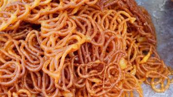 Jalebi is commonly known as jilapi, julbia, jilipi or zalabia. Jalebi is a famous sweet snack in South Asian countries, specially Indian subcontinent. video