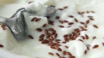 Flax seed on yogurt, close up video