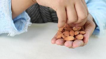 Almond snack in one hand video
