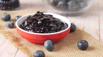 Blueberry jam in a bowl, close up video