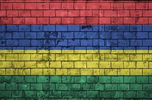 Mauritius flag is painted onto an old brick wall photo