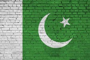 Pakistan flag is painted onto an old brick wall photo