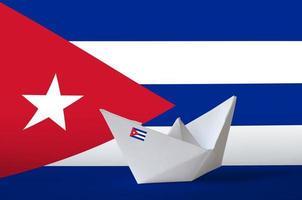 Cuba flag depicted on paper origami ship closeup. Handmade arts concept photo