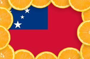 Samoa flag in fresh citrus fruit slices frame photo