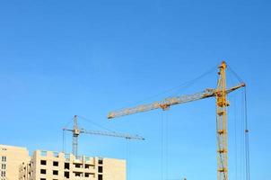 Building under construction with crane photo