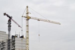 Building under construction with crane photo