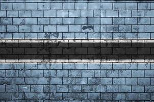 Botswana flag is painted onto an old brick wall photo