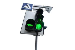 Traffic lights with the green light lit isolated on white photo