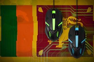 Sri Lanka flag and two mice with backlight. Online cooperative games. Cyber sport team photo