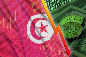 Tunisia flag and cryptocurrency falling trend with two bitcoins on dollar bills and binary code display photo