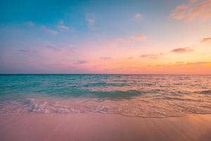 Closeup sea sand beach. Panoramic beach landscape. Inspire tropical seascape horizon. Orange and golden sunset sky clouds. Tranquil relaxing freedom beach shore happy romantic meditation summer nature photo