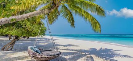 Amazing beach landscape, super wide panoramic exotic travel background. Luxury travel, idyllic couple honeymoon love destination. Sunny sea sand sky, exotic resort coast. Palm lagoon, seascape banner photo