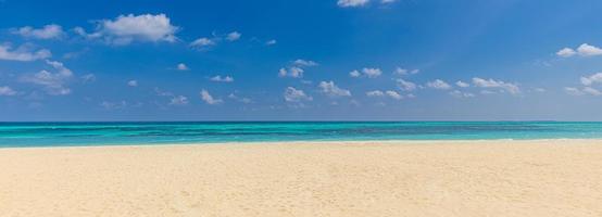 Summer vacation, holiday background. Tropical beach blue sea and white clouds banner. Beautiful Mediterranean beach, panoramic shore, travel destination scenic. Sand seascape, sunny horizon landscape photo