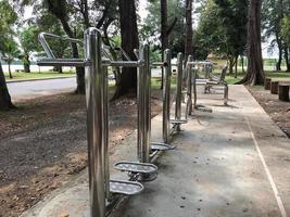 Stainless exercise equipment in the park area, free service for people. photo