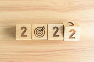 2022 change to 2023 Year block with dartboard icon. Goal, Target, Resolution, strategy, plan, Action, mission, motivation, and New Year start concepts photo