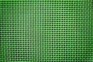 Weaving or mesh pattern background. green plastic texture photo