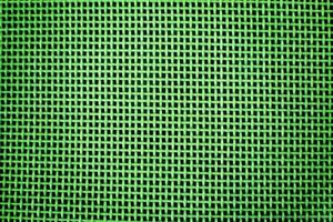 Weaving or mesh pattern background. green plastic texture photo