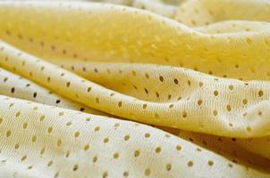 Yellow mesh sport wear fabric textile background pattern photo