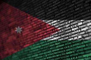 Jordan flag is depicted on the screen with the program code. The concept of modern technology and site development photo