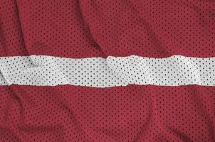 Latvia flag printed on a polyester nylon sportswear mesh fabric photo