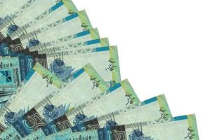 500 Kazakhstani tenge bills lies isolated on white background with copy space stacked in fan close up photo