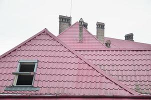 Fragment of a metal roof of the restored old multi-storey building in Lviv, Ukraine photo