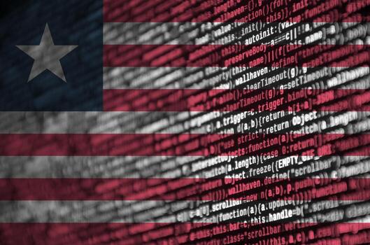 la bandera de liberia se representa en la pantalla con el código del programa. el concepto de tecnología moderna y desarrollo de sitios foto