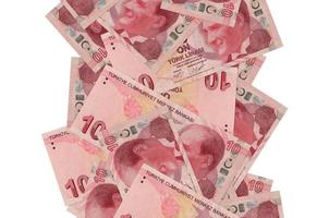 10 Turkish liras bills flying down isolated on white. Many banknotes falling with white copyspace on left and right side photo