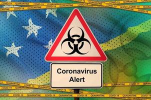 Solomon Islands flag and Covid-19 biohazard symbol with quarantine orange tape. Coronavirus or 2019-nCov virus concept photo